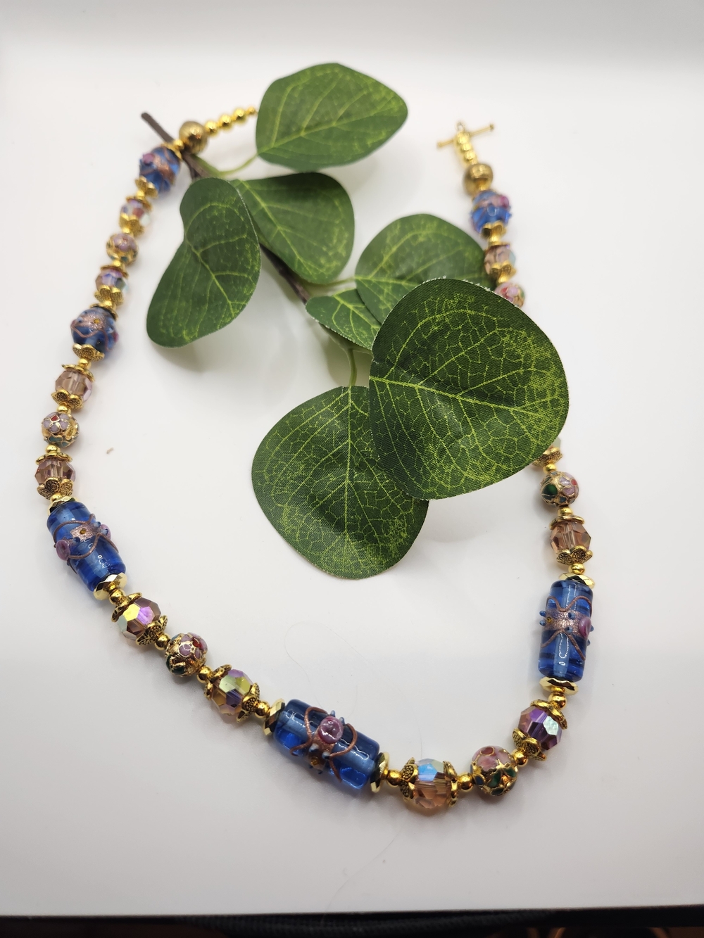 Gold-Tone Blue Glass Bead Necklace with Floral Accents